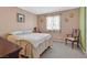 Cozy bedroom with carpet, floral curtains, and natural light at 421 Engel Ave, Henderson, NV 89011