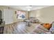 Inviting living room showcasing wood flooring, comfortable couches and a bright window view at 421 Engel Ave, Henderson, NV 89011