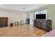 Spacious living room with wood floors, ample lighting, and comfortable furnishings at 421 Engel Ave, Henderson, NV 89011