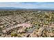A stunning aerial view showcases a sprawling residential area with meticulously planned streets and lush green trees dotting the landscape at 435 Piute Valley Ct, Henderson, NV 89012