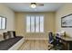 Bright bedroom with a desk, daybed, and wood floors at 435 Piute Valley Ct, Henderson, NV 89012