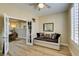 Bright bedroom with french doors, a sofa, and wood floors at 435 Piute Valley Ct, Henderson, NV 89012