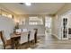 Bright dining room with wood floors and an open layout to the kitchen at 435 Piute Valley Ct, Henderson, NV 89012