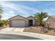 Charming single-story home with a two car garage and desert landscaping at 435 Piute Valley Ct, Henderson, NV 89012