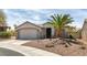 Charming single-story home with a two car garage and desert landscaping at 435 Piute Valley Ct, Henderson, NV 89012