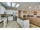 Bright kitchen with granite countertops, stainless appliances, and a butcher block island, adjacent to the living room at 435 Piute Valley Ct, Henderson, NV 89012