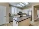 Bright kitchen features a center island with butcher block top, white cabinetry, and stainless steel appliances at 435 Piute Valley Ct, Henderson, NV 89012