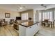 Open concept living and dining area includes a center island with butcher block top and seating at 435 Piute Valley Ct, Henderson, NV 89012
