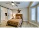 Stylish main bedroom with a rustic touch, featuring wood flooring and a barn door at 435 Piute Valley Ct, Henderson, NV 89012