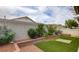 Backyard features a tiered garden bed with a seating area at 4411 Wild Honey Ct, Las Vegas, NV 89147