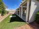 Backyard with an artificial lawn, planter, patio and privacy fence at 4411 Wild Honey Ct, Las Vegas, NV 89147