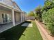 Backyard featuring patio and artificial lawn area, perfect for entertaining at 4411 Wild Honey Ct, Las Vegas, NV 89147