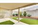 Covered patio with artificial turf and low-maintenance landscaping at 4411 Wild Honey Ct, Las Vegas, NV 89147