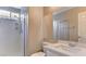This bathroom features a spacious glass-enclosed shower and a modern vanity with a white countertop at 4411 Wild Honey Ct, Las Vegas, NV 89147