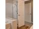 Bright bathroom features a glass enclosed shower and a soaking tub at 4411 Wild Honey Ct, Las Vegas, NV 89147