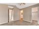 Bedroom with carpeted floor, access to the bathroom and walk-in closet at 4411 Wild Honey Ct, Las Vegas, NV 89147