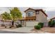 Charming two-story home featuring a well-manicured front yard and inviting curb appeal at 4411 Wild Honey Ct, Las Vegas, NV 89147