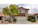 Charming two-story home features a two-car garage and desert landscaping at 4411 Wild Honey Ct, Las Vegas, NV 89147
