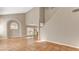 Bright living room with archway, tile floors, neutral walls and natural light through sliding glass doors at 4411 Wild Honey Ct, Las Vegas, NV 89147