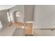 View from the top of the stairs with a view of the living room featuring an arched window and tile flooring at 4411 Wild Honey Ct, Las Vegas, NV 89147