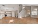 Open-concept living space with tile floors, neutral walls and staircase to second floor at 4411 Wild Honey Ct, Las Vegas, NV 89147