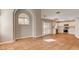 Open-concept living space with tile floors adjacent to the bright kitchen and natural light at 4411 Wild Honey Ct, Las Vegas, NV 89147