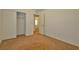 Bedroom features neutral tones, carpeted floors, closet, and doorway to another room at 4905 Quiet Morning St, Las Vegas, NV 89122