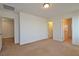 Spacious bedroom featuring neutral carpet and three doorways to other rooms at 4905 Quiet Morning St, Las Vegas, NV 89122
