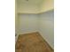 Walk-in closet with carpeted floor and rods for hanging clothes at 4905 Quiet Morning St, Las Vegas, NV 89122