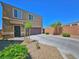 Exterior view of home showcasing desert landscaping, attached garage, and covered entryway at 4905 Quiet Morning St, Las Vegas, NV 89122