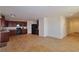 Spacious kitchen with dark wood cabinets, granite countertops, and a large open area at 4905 Quiet Morning St, Las Vegas, NV 89122