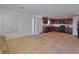 Open floor plan featuring kitchen with dark cabinetry and spacious living area at 4905 Quiet Morning St, Las Vegas, NV 89122