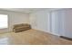Bright living area with sliding glass door access to the outdoor area, with tan colored couch at 4905 Quiet Morning St, Las Vegas, NV 89122