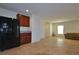 Open living space with stainless steel refrigerator and access to other rooms at 4905 Quiet Morning St, Las Vegas, NV 89122