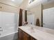 Cozy bathroom featuring a shower-tub combo, a neutral color palette and a single sink vanity at 5521 Moss Landing St, North Las Vegas, NV 89031