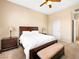 Inviting bedroom showcasing a comfortable bed, neutral paint, ceiling fan, and carpet floors at 5521 Moss Landing St, North Las Vegas, NV 89031