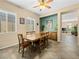Traditional dining room with a wood table and chairs, plus large windows providing natural light at 5521 Moss Landing St, North Las Vegas, NV 89031