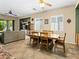 Open concept living and dining area featuring neutral tile, ample windows and a ceiling fan at 5521 Moss Landing St, North Las Vegas, NV 89031