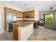 Spacious kitchen with a large island, stainless steel appliances, and opens to the living room at 5521 Moss Landing St, North Las Vegas, NV 89031