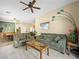 Spacious living room with neutral carpet, multiple sofas, and view to the kitchen at 5521 Moss Landing St, North Las Vegas, NV 89031