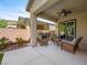 Outdoor patio with a built-in grill, comfortable seating, and privacy walls at 5521 Moss Landing St, North Las Vegas, NV 89031