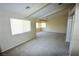 Bright bedroom featuring large windows and neutral carpet at 5808 Amber Station Ave, Las Vegas, NV 89131