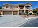 A beautiful home featuring a three-car garage, meticulously maintained landscaping and a lengthy driveway at 5808 Amber Station Ave, Las Vegas, NV 89131