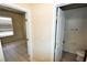 Hallway view leading to a bedroom and a bathroom with tile flooring and neutral wall colors at 5808 Amber Station Ave, Las Vegas, NV 89131