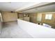 Spacious loft area with carpet flooring and views of the staircase and downstairs living spaces at 5808 Amber Station Ave, Las Vegas, NV 89131
