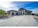 Stunning two-story modern home featuring a spacious driveway, multi-car garage, and manicured landscaping at 600 Quail Covey Road, Henderson, NV 89002