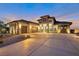 Stunning home exterior featuring a grand entrance, manicured landscaping, and a spacious driveway at 600 Quail Covey Road, Henderson, NV 89002