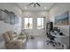 Functional home office with modern desk, ergonomic chair, and comfortable seating area at 600 Quail Covey Road, Henderson, NV 89002
