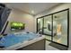 Beautiful indoor hot tub with a view into the main bedroom with tile floors and modern fixtures at 600 Quail Covey Road, Henderson, NV 89002