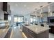 Bright kitchen with modern appliances, an island with bar seating, and pendant lighting fixtures at 600 Quail Covey Road, Henderson, NV 89002